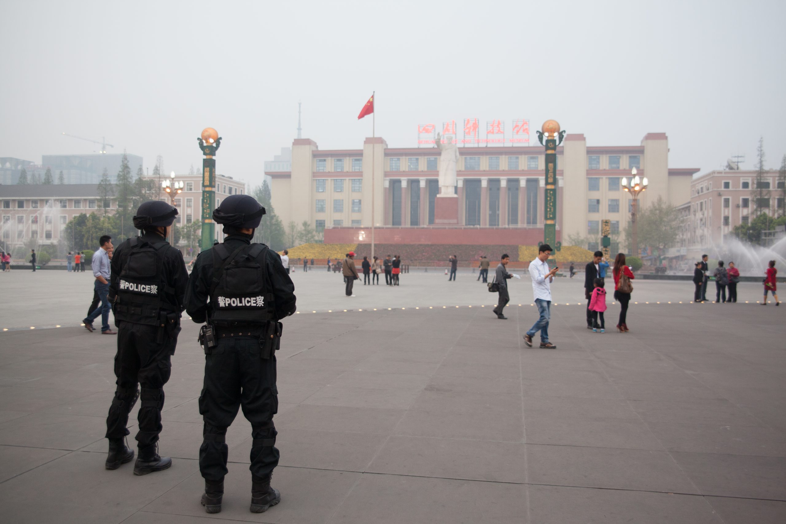two-policemen-standing-city-square
