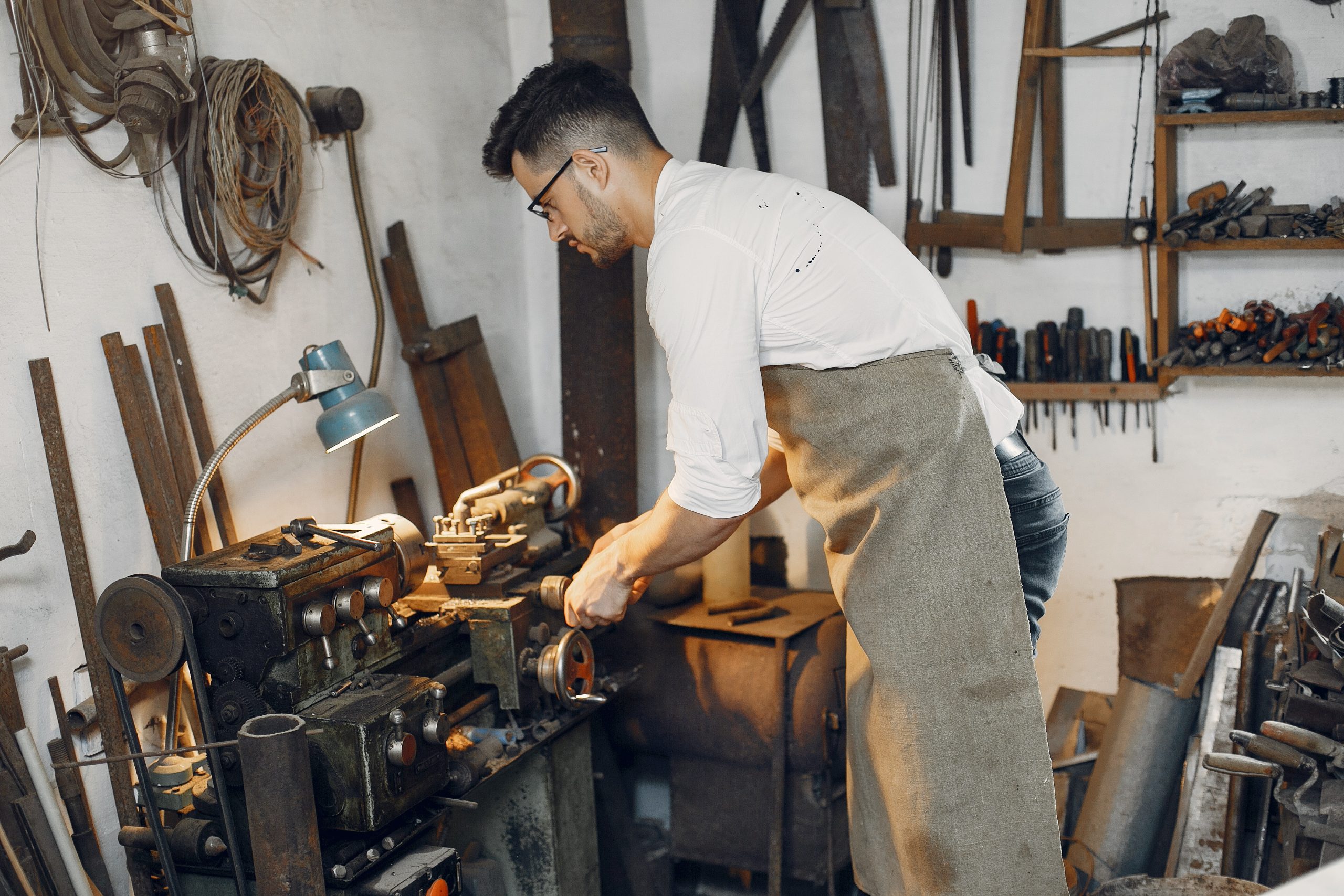 Handsome carpenter working with a wood